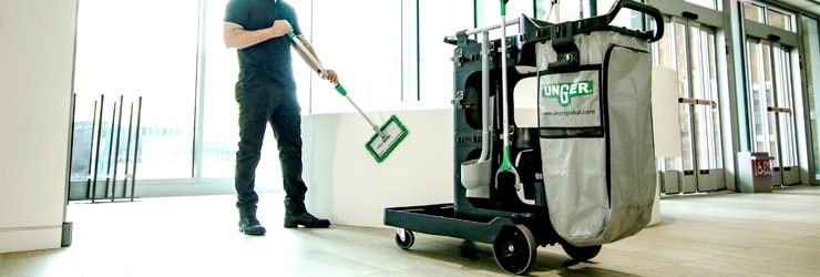 Janitorial cleaning cart with janitor cleaning surfaces